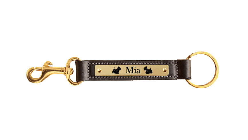 Leather nameplate key fob with brass snap and custom engraved dog design. Dog Key Fob