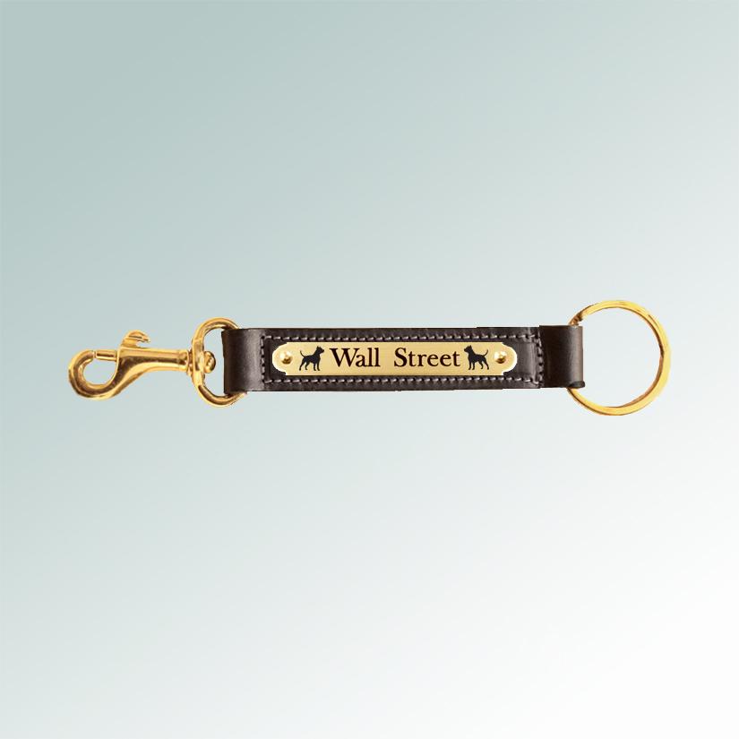 Leather nameplate key fob with brass snap and custom engraved dog breed design. Dog Breed Key Fob