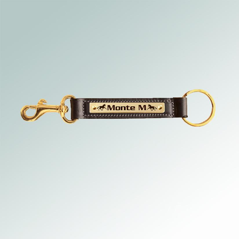 Personalized horse silhouette brass nameplate on a leather key fob with a brass bolt snap.