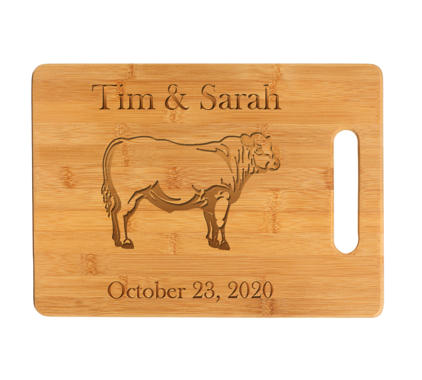 Personalized bamboo cutting board with your choice of farm animal design and custom engraved text. Cow Cutting Board