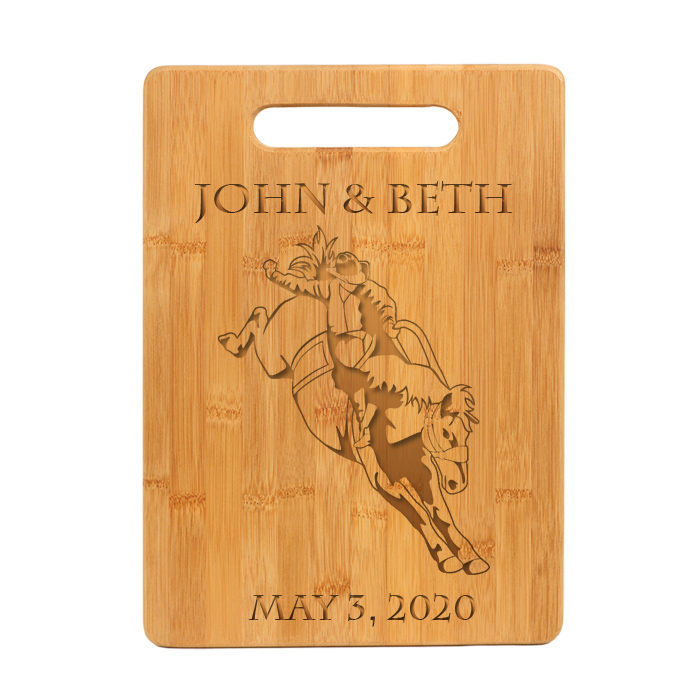 Custom engraved bamboo cutting board with engraved rodeo design and personalized engraved text.