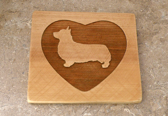 Custom engraved ceramic trivet / hot plate with engraved Welsh Corgi dog design and personalized text.