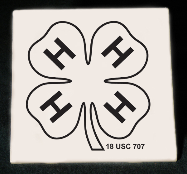 Personalized ceramic 4-H logo trivet with engraved text.