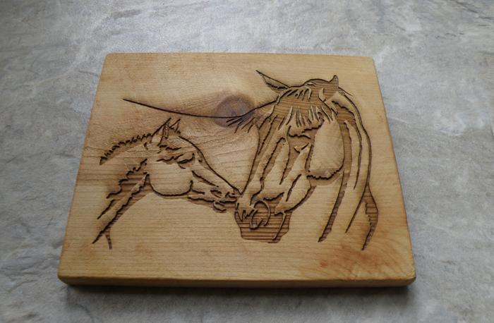 Custom engraved mare and foal horse trivet made out of cedar.
