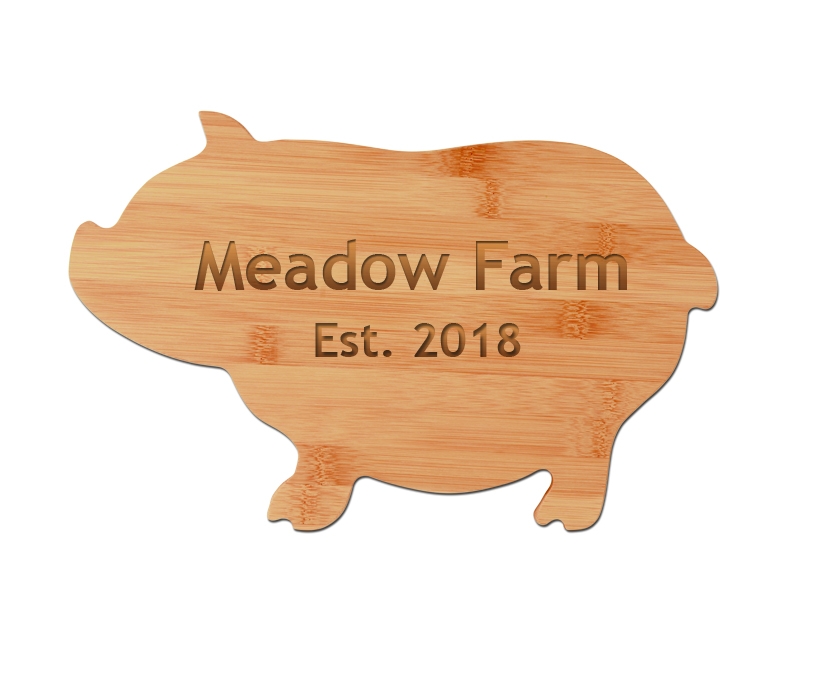 Engraved pig shaped bamboo cutting board with your choice of personalized text. Pig Cutting Board