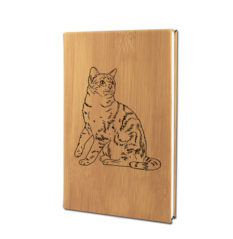Personalized leatherette journal with custom engraved cat design and text.