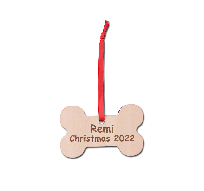 Personalized engraved wood dog bone ornament with engraved text. Dog Bone Ornament