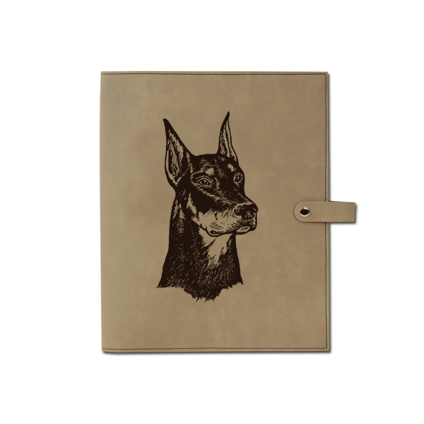 The leatherette book / bible cover comes with a custom engraved Doberman dog design and personalized text.