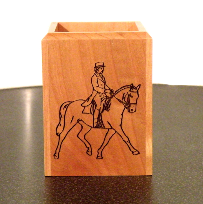 Personalized maple wood pen holder with custom engraved horse design and engraved text.