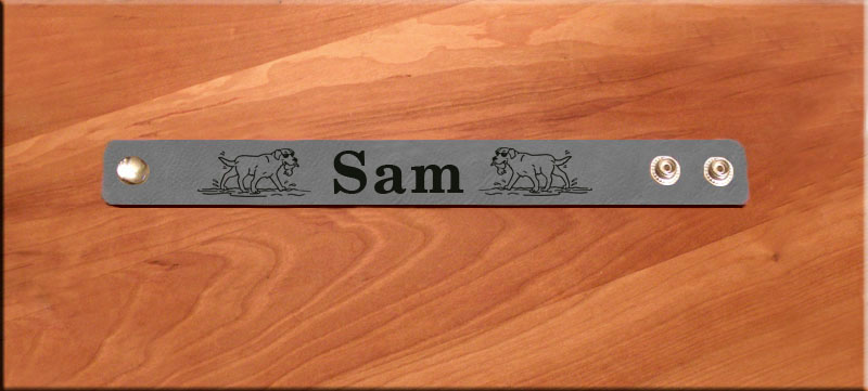 Custom engraved leatherette bracelet with you choice of sporting dog design and personalized text.