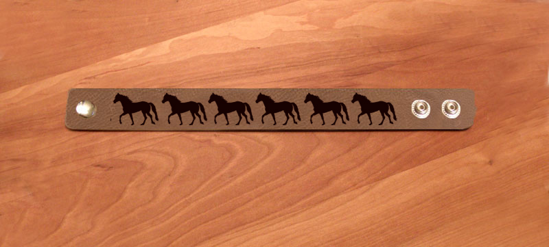 Custom engraved line of horses leatherette equestrian bracelet. Equestrian Bracelet