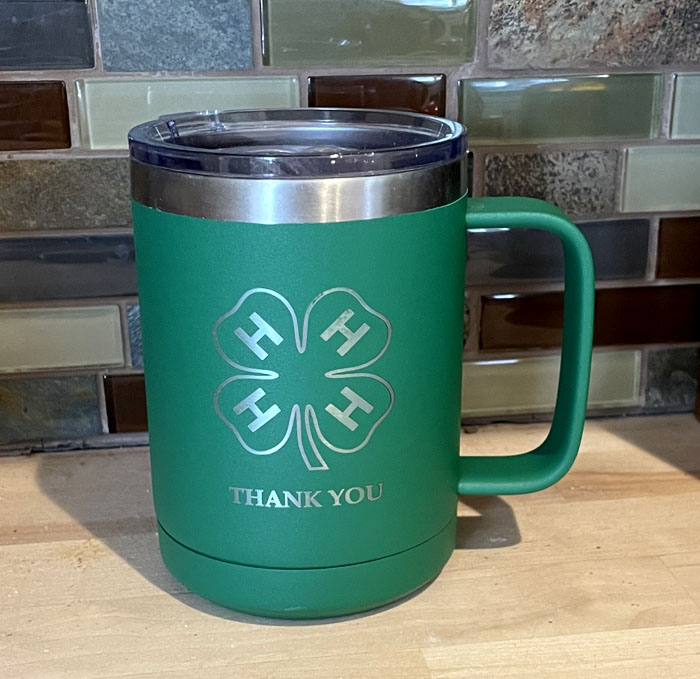 Stainless steel insulated mug with a 4-H logo with the words Thank You. 4-H Mug