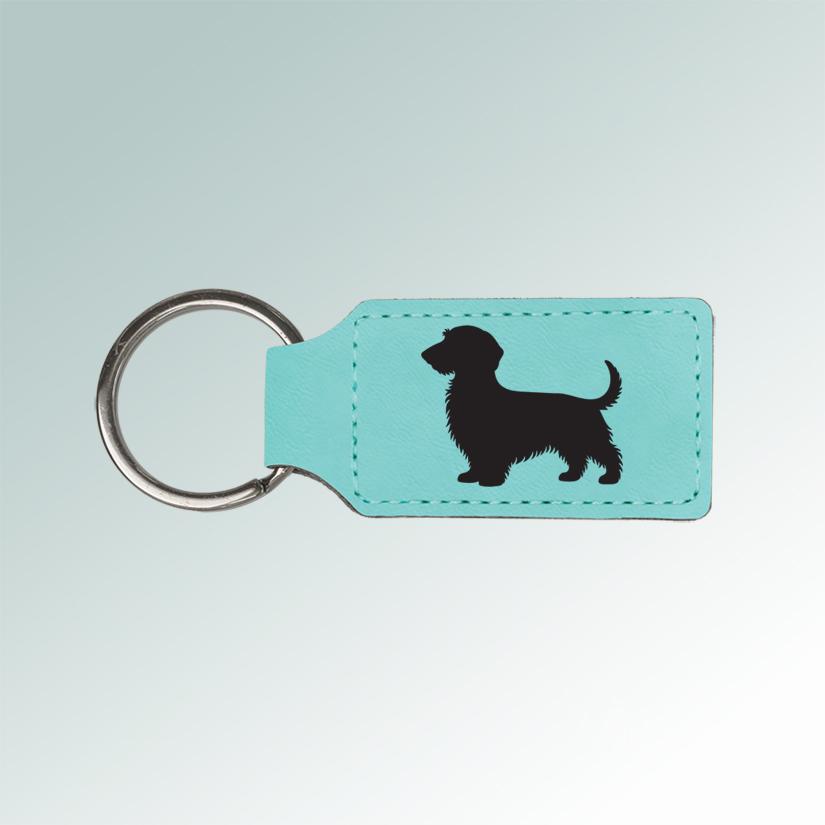 Personalized leatherette dog breed key chain with your choice of engraved dog breed design and text. Dog Key Chain