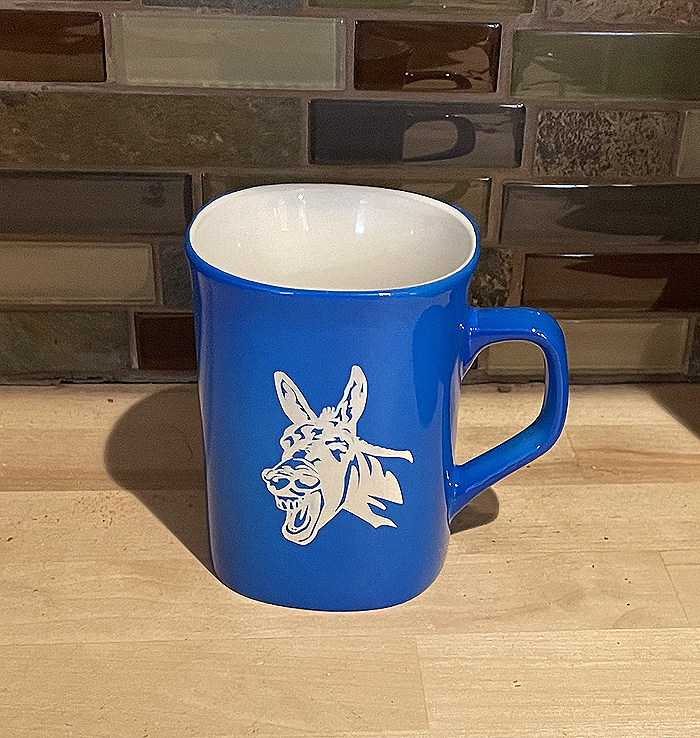 Blue ceramic round coffee mug with a donkey head engraved on the front. Donkey Mug