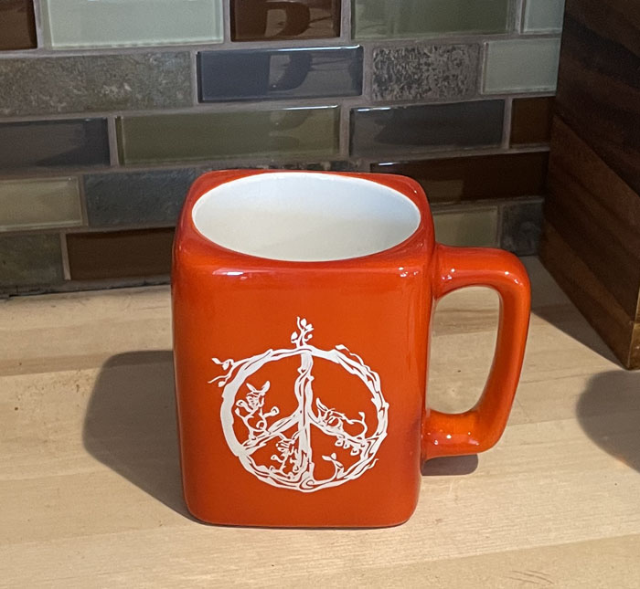 Peace donkey square coffee mug that has a peace sign and 3 donkey designs.