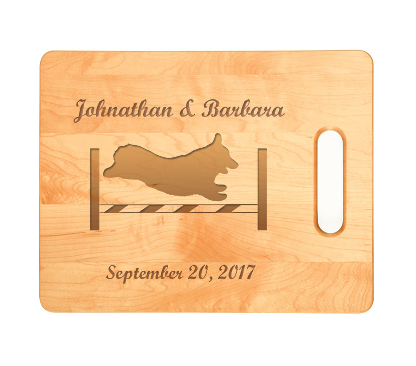 Personalized maple wood cutting board with engraved Corgi dog design and text.