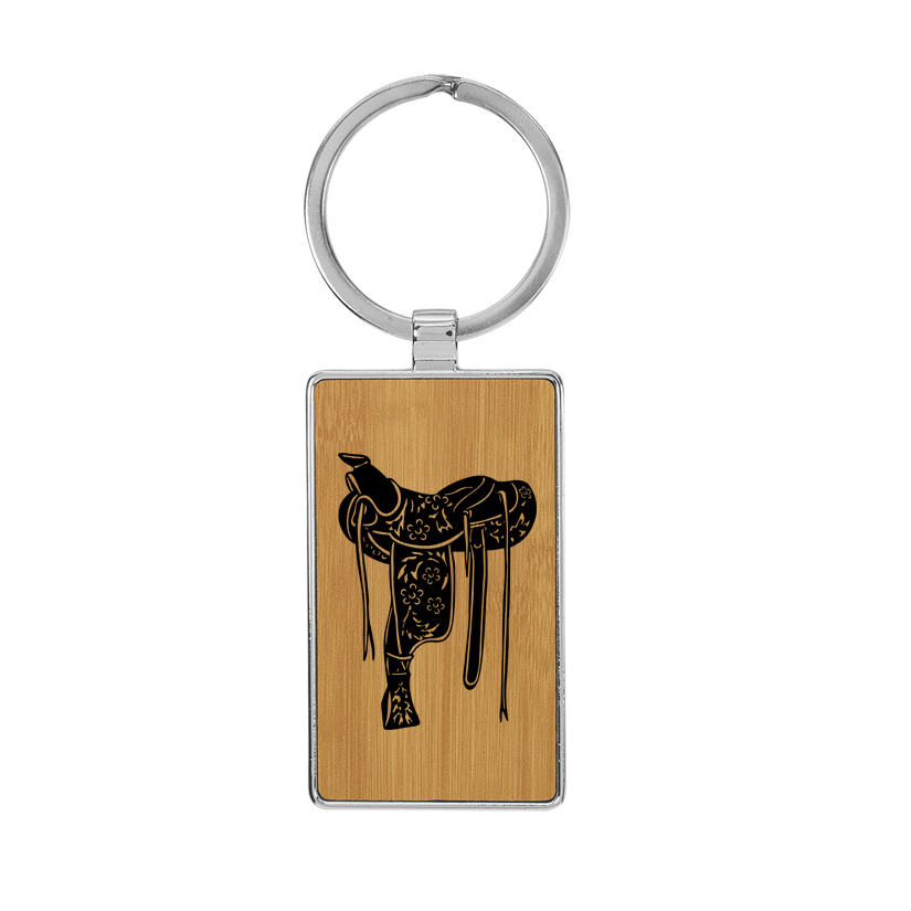 Metal frame leatherette keychain with your choice of rodeo design and personalized text. Rodeo Keychain