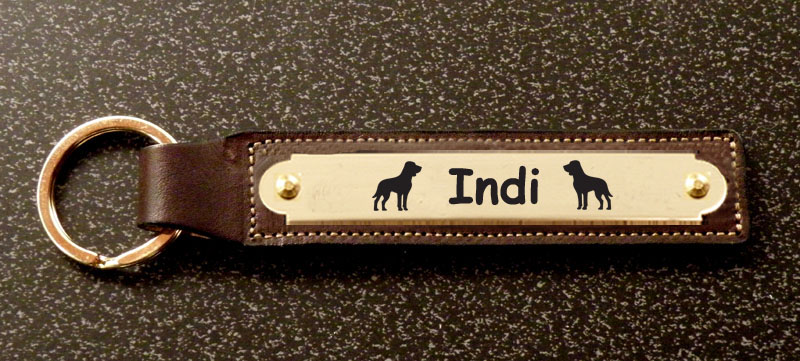 Leather key fob with an engraved brass nameplate with your choice of text and dog silhouette. Dog Nameplate Fob
