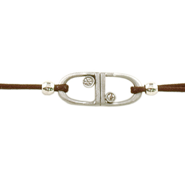 Equestrian jewelry bracelets that feature 2 English stirrups on a brown leather tie closure cord.