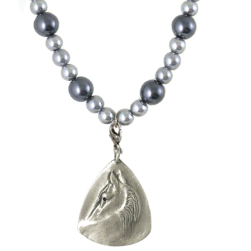 Glancing Horse Pendant on a on a graphite and charcoal pearl necklace.