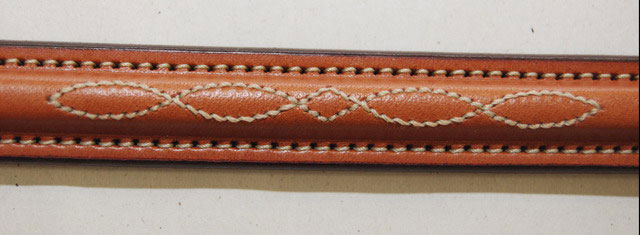 This dog collar has raised fancy stitched leather with a nameplate blank.