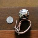 Size comparison for our leather buckle strap silver bear bell from Auburn Leathercrafters.