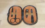 Corgi travel manicure set with a corgi in a bathtub engraved on the front.