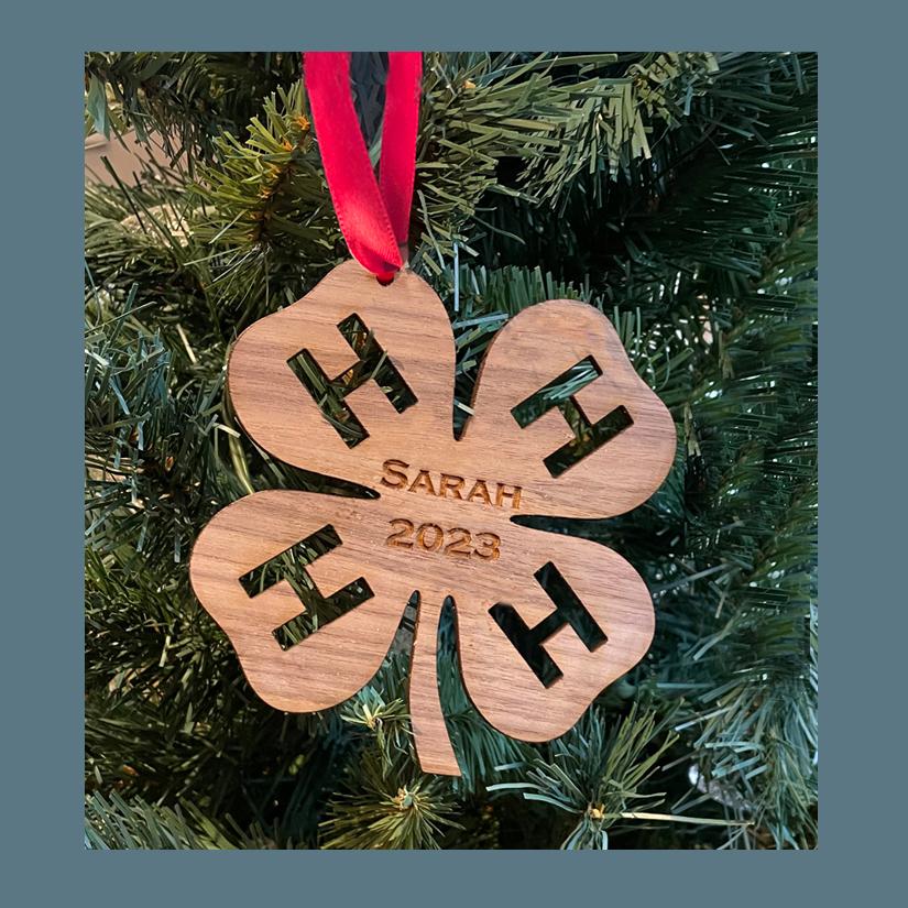 Wood 4-H logo Christmas ornament with your choice of wood type, size and personalized text. 4-H Logo Ornament