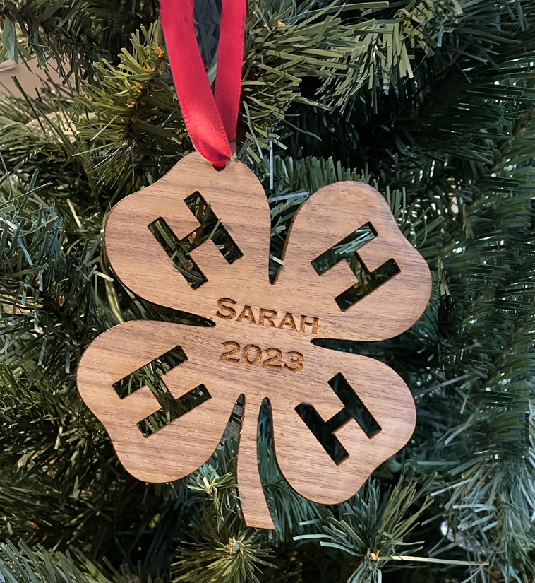 Wood 4-H logo Christmas ornament with your choice of wood type, size and personalized text. 4-H Logo Ornament