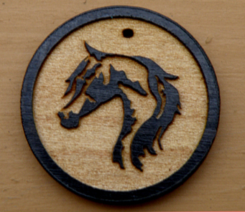 Laser engraved wood horse head charm necklace.