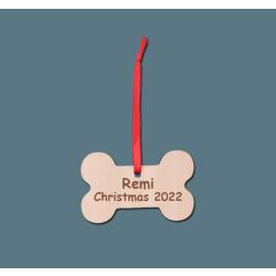 Personalized engraved wood dog bone ornament with engraved text. Dog Bone Ornament