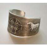 Pewter cuff bracelet with a Celtic cross and a running horse.