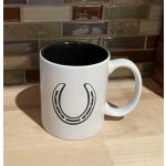 White ceramic round coffee mug with a horseshoe engraved on the front. Equestrian Mug