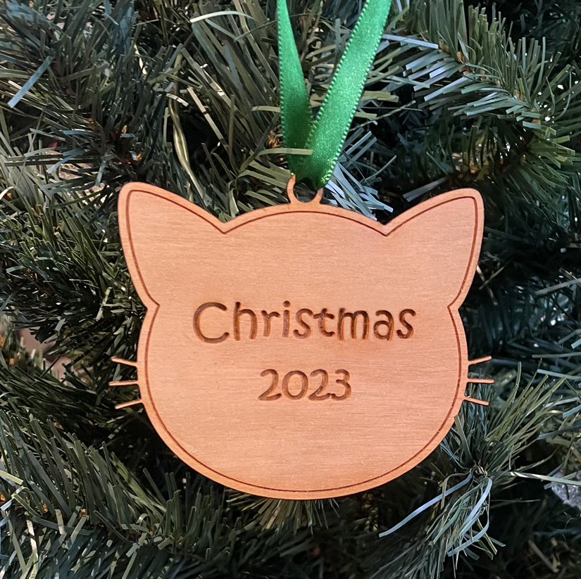 Wood cat head Christmas ornament with your choice of wood type, size and personalized text. Cat Ornament