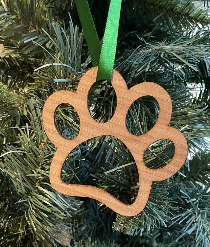 Wood dog paw Christmas ornament with your choice of wood type and size. Dog Paw Ornament