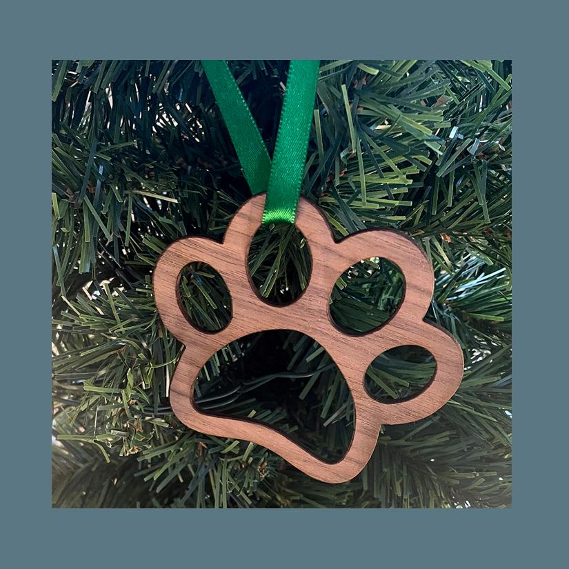 Wood dog paw Christmas ornament with your choice of wood type and size. Dog Paw Ornament