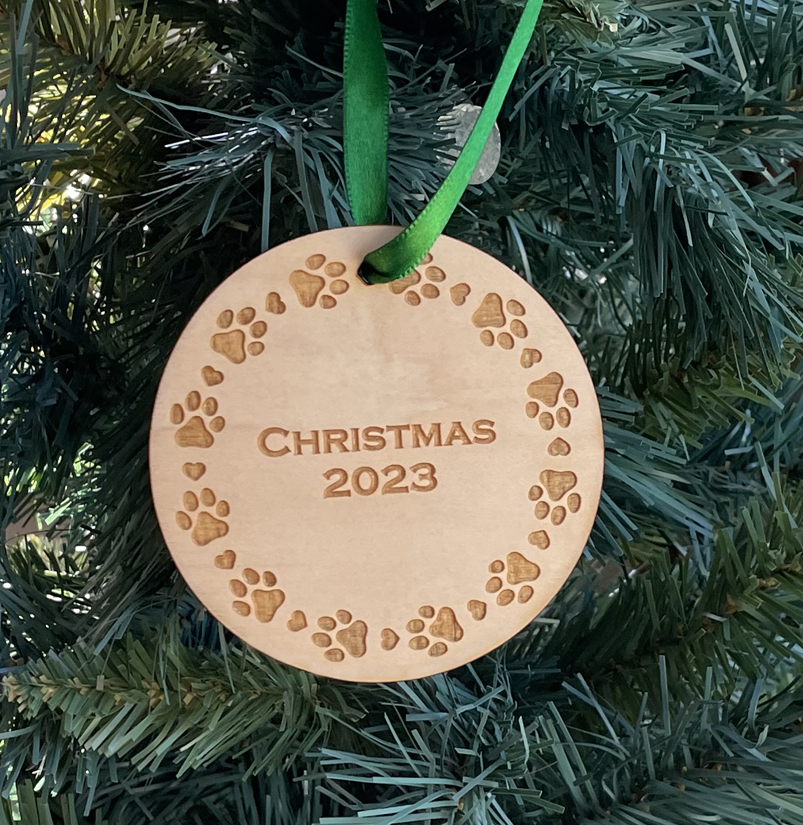 Laser cut round paw print wood Christmas ornament comes in 3 sizes and a variety of wood types. Dog Paw Ornament