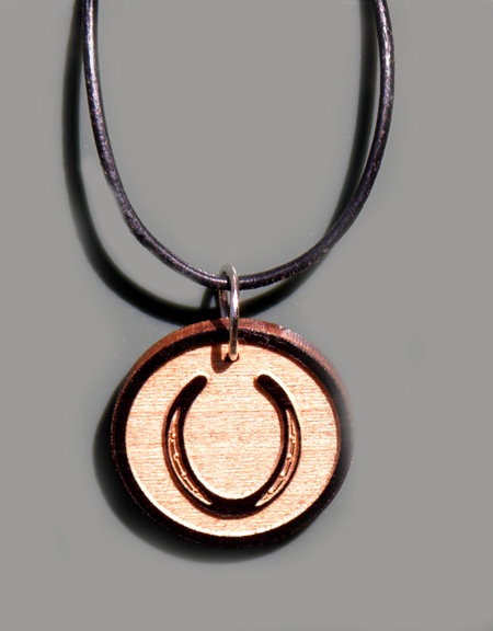 Custom engraved wood horseshoe design charm.