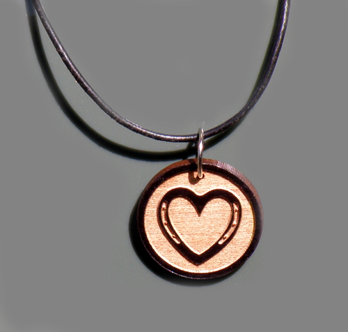 Custom engraved wood horseshoe heart design charm.